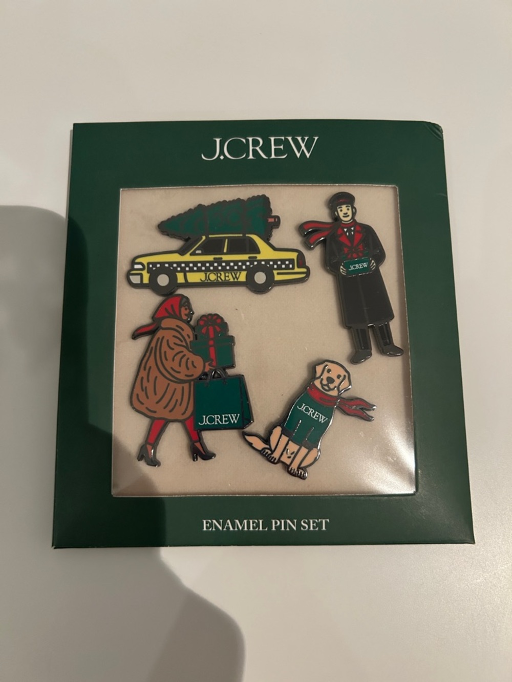 Brand new set of J. Crew Holiday Enamel Pin Set - Green, Red, Yellow, Black